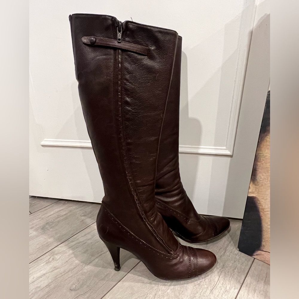 Brown leather boots, heels need to be retouched slightly scratched.